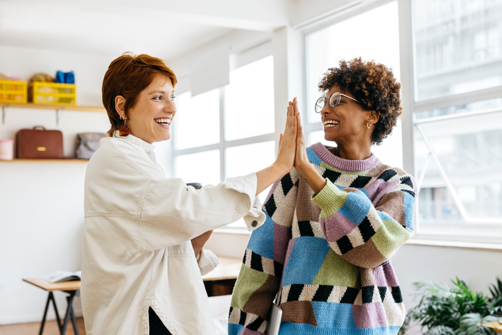 two friends high-fiving