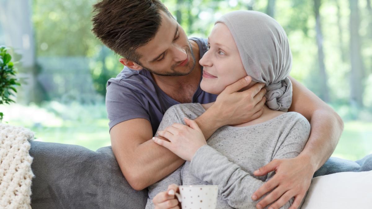 Man caring for brain cancer patient 