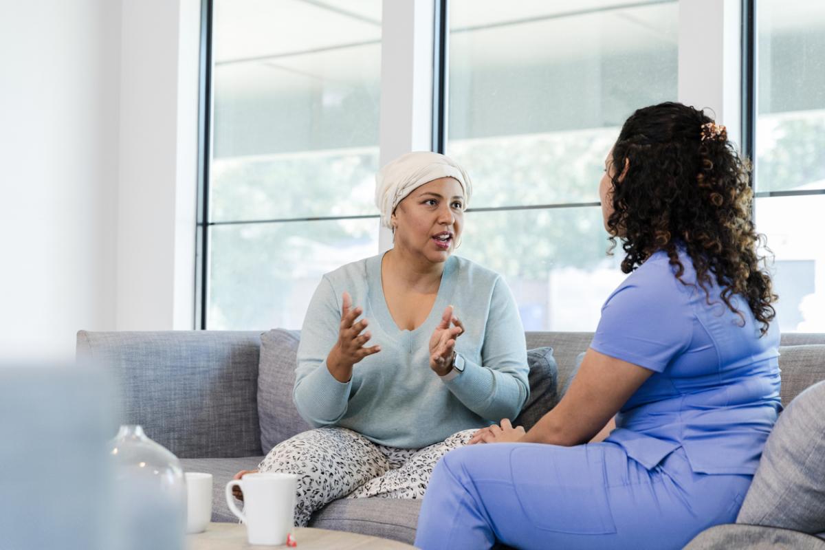 Adult female cancer patient asks her nurse questions
