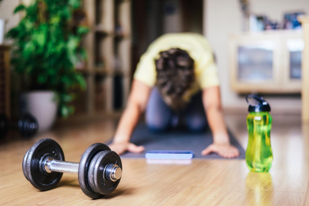 Woman At Home Doing Sports Training Stretching