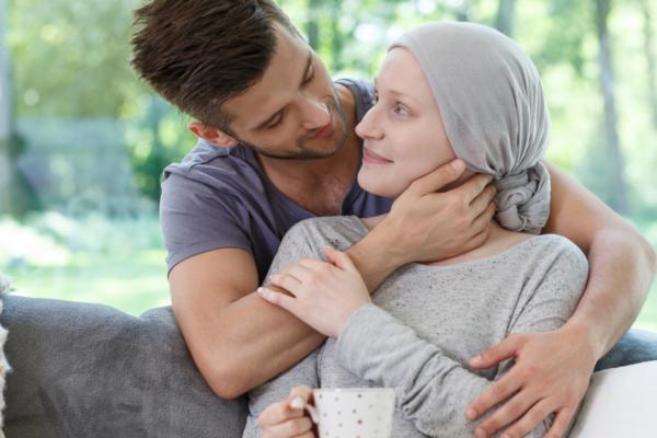 Man caring for brain cancer patient 