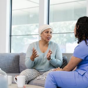 Adult female cancer patient asks her nurse questions