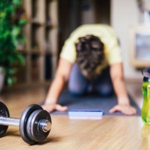 Woman At Home Doing Sports Training Stretching